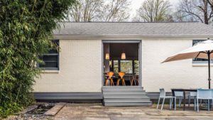 Dining Room Opens Onto Outdoor Patio with Fountain