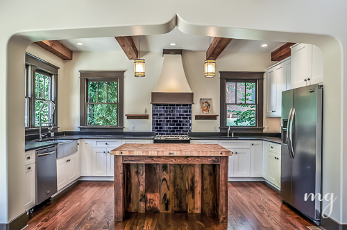 Kitchen Island made from reclaimed wood. Cobalt Blue subway tiles.