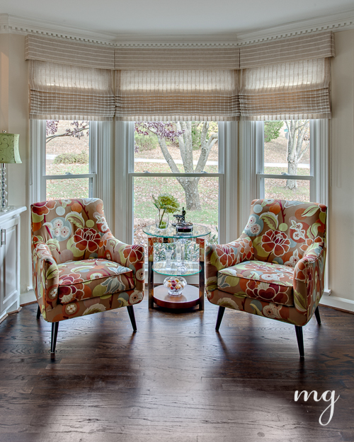 Armchairs feature bold floral patterns in bright citrus colors