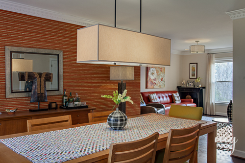 View of Dining Room with Orange Faux Grasscloth and Tribal Accents