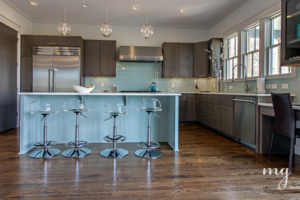 Kitchen island in ice blue with acrylic bar stools