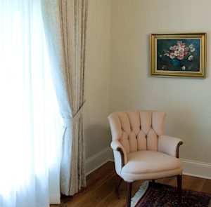 Pink Traditional Chair beside Window Treatment